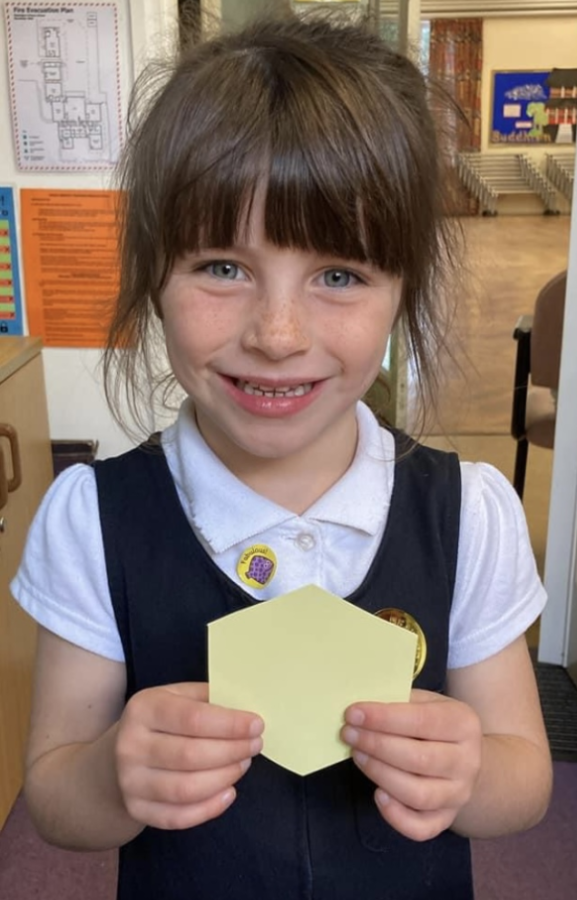 One of our pupils receives a hexagon award.